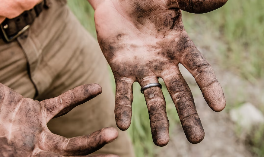 Hands covered in Soot from a Log Burner