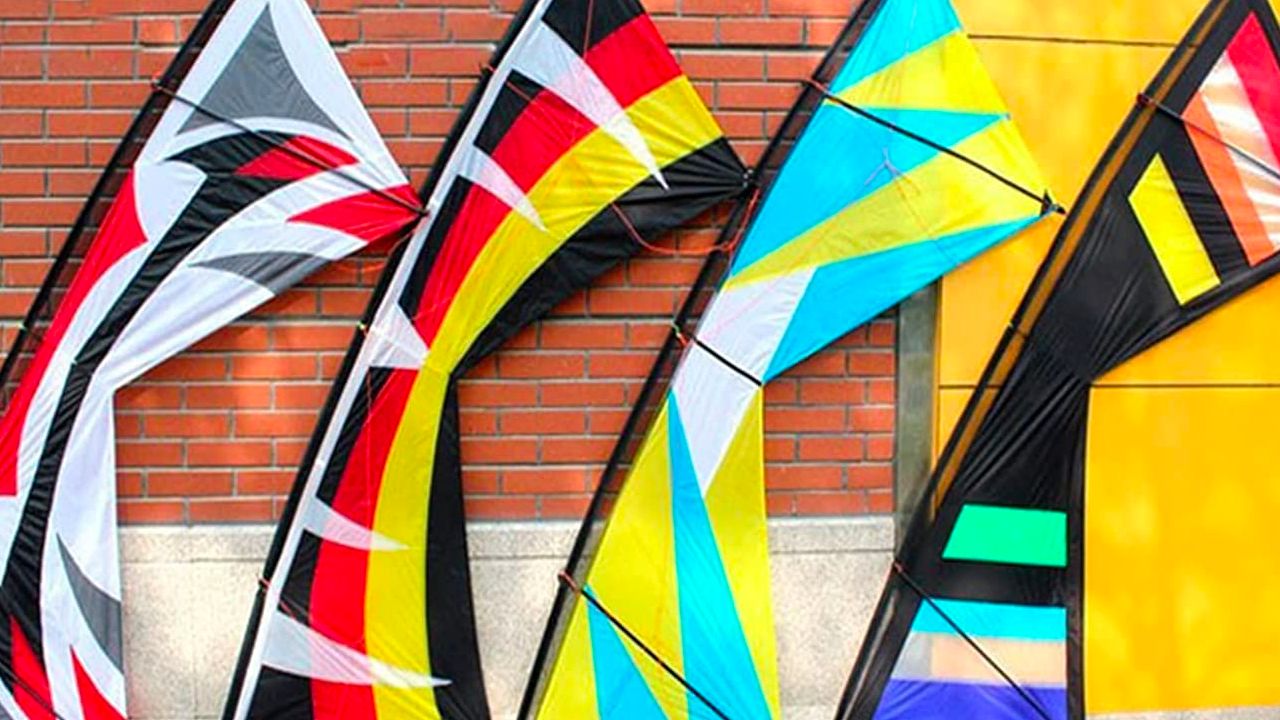 Photo of 4 Stunt Kites leaning against a brick wall